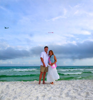 It's a girl baby reveal with a plane on the beach