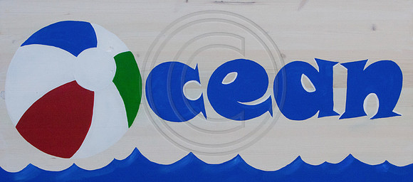 Ocean-beach-ball-on wood